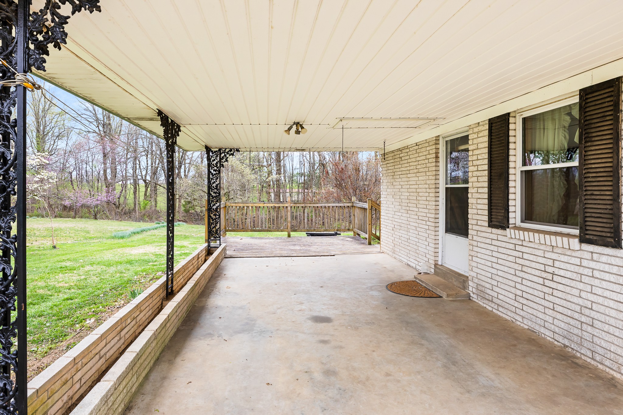 111 Cothron Drive Lafayette, TN 37083 - Photo 5 of 33 a view of a porch with a floor to ceiling window