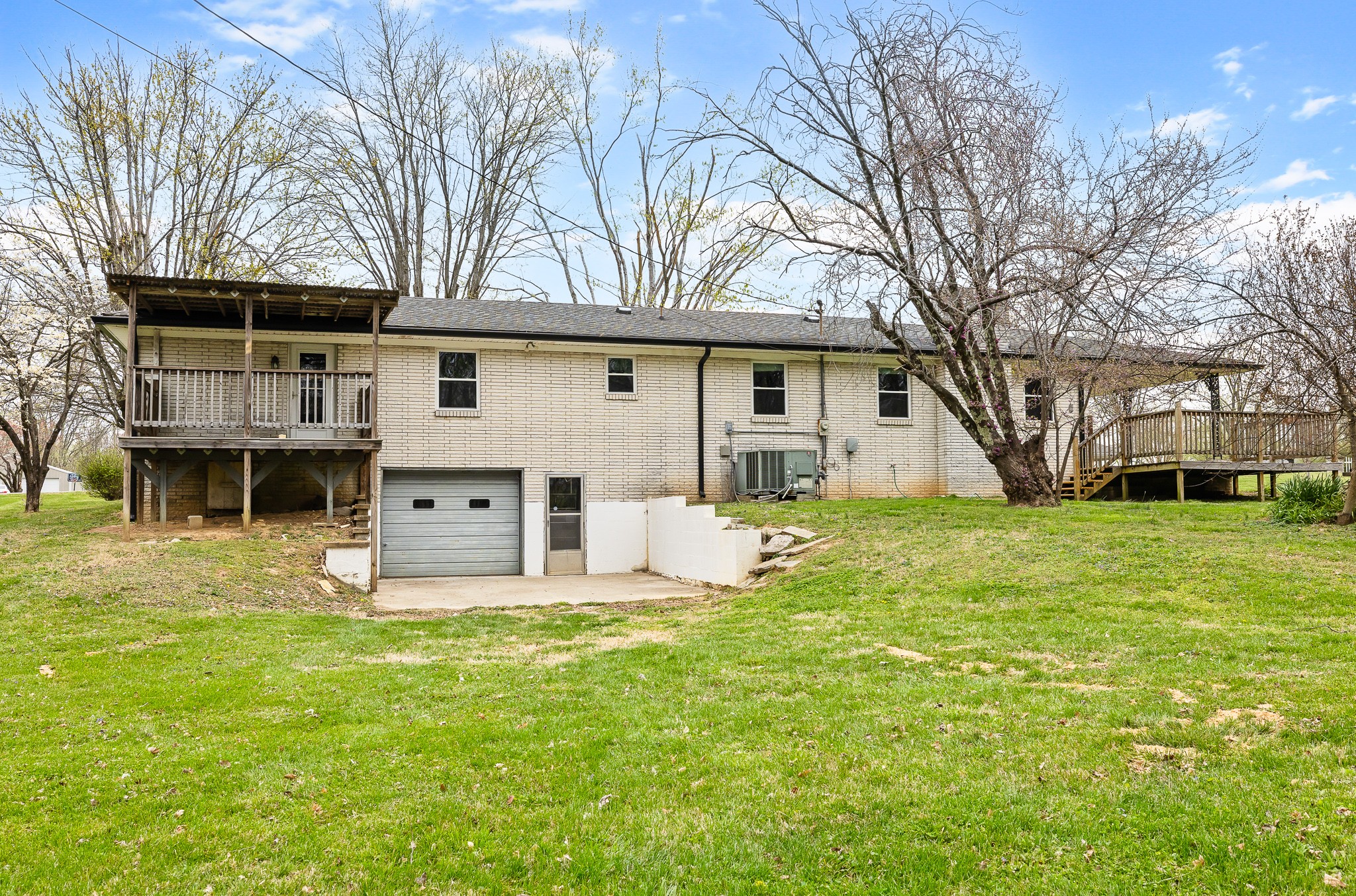 111 Cothron Drive Lafayette, TN 37083 - Photo 7 of 33 a house that has a tree in front of it