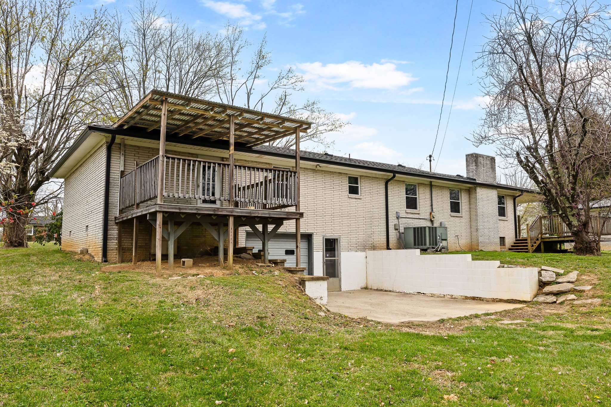 111 Cothron Drive Lafayette, TN 37083 - Photo 8 of 33 a view of a house with a yard and large tree