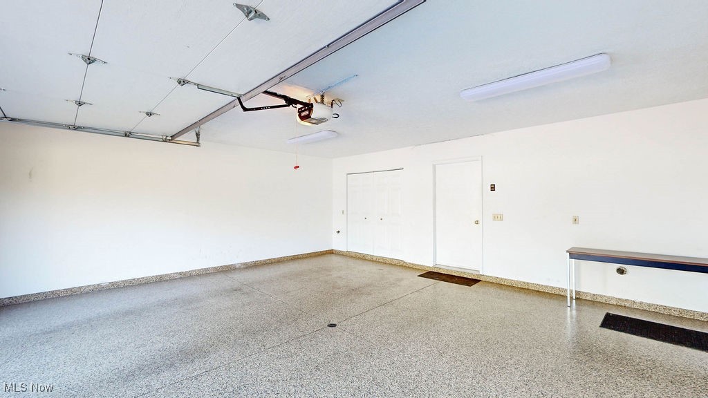 1426 Loop Road, Unit 1426 Kent, OH 44240 - Photo 22 of 40 2 car attached garage with Amorlike coating on the floor for easy care and maintenance, garage door opener, ample storage and the mechanical room.