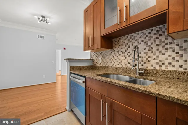 a kitchen with a sink and cabinets