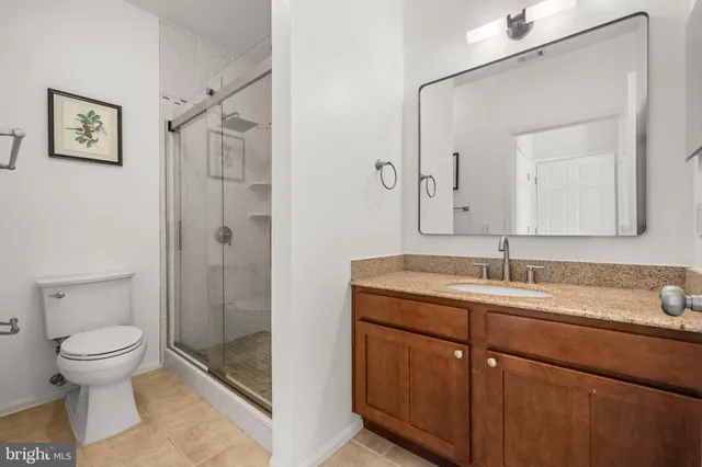 a bathroom with a toilet sink and shower
