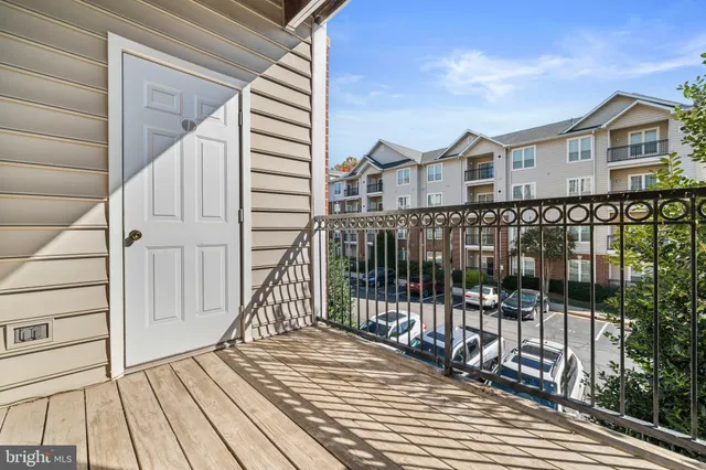 a view of a balcony with wooden floor