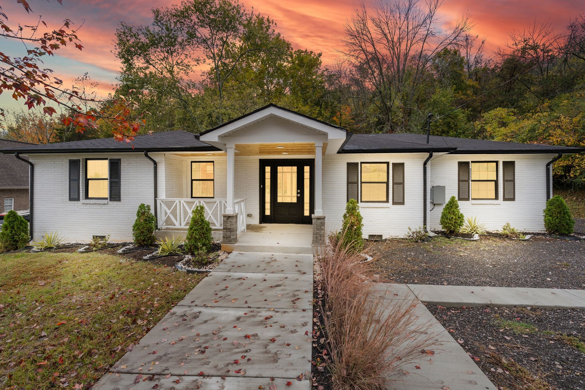 a front view of a house with garden