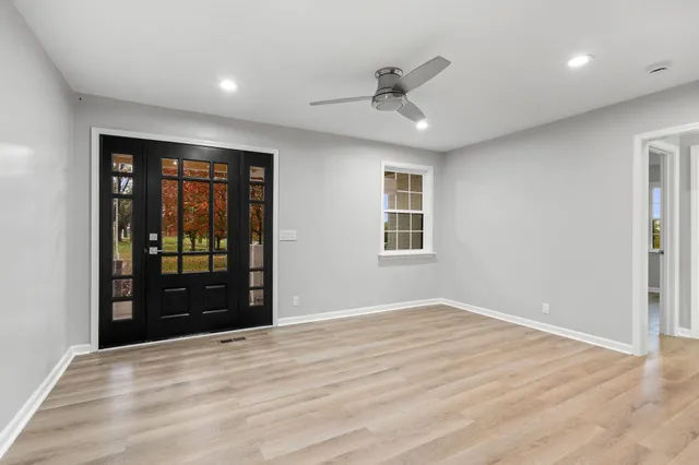 a view of a kitchen with wooden floor and a kitchen