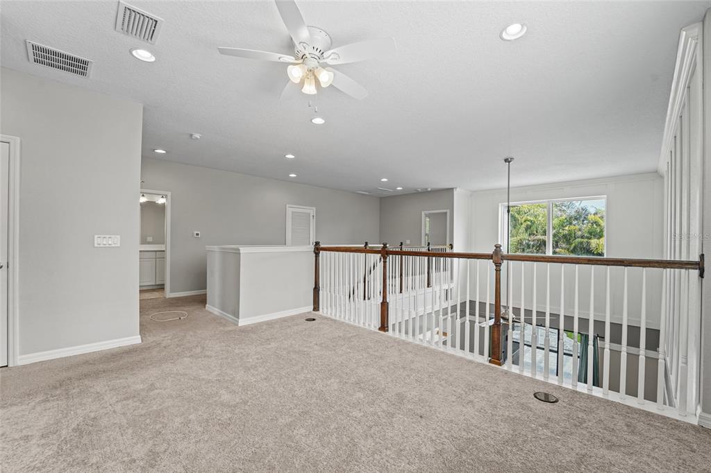 8903 Arabella Lane Seminole, FL 33777 - Photo 37 of 47 a view of a livingroom with furniture window a ceiling fan and window