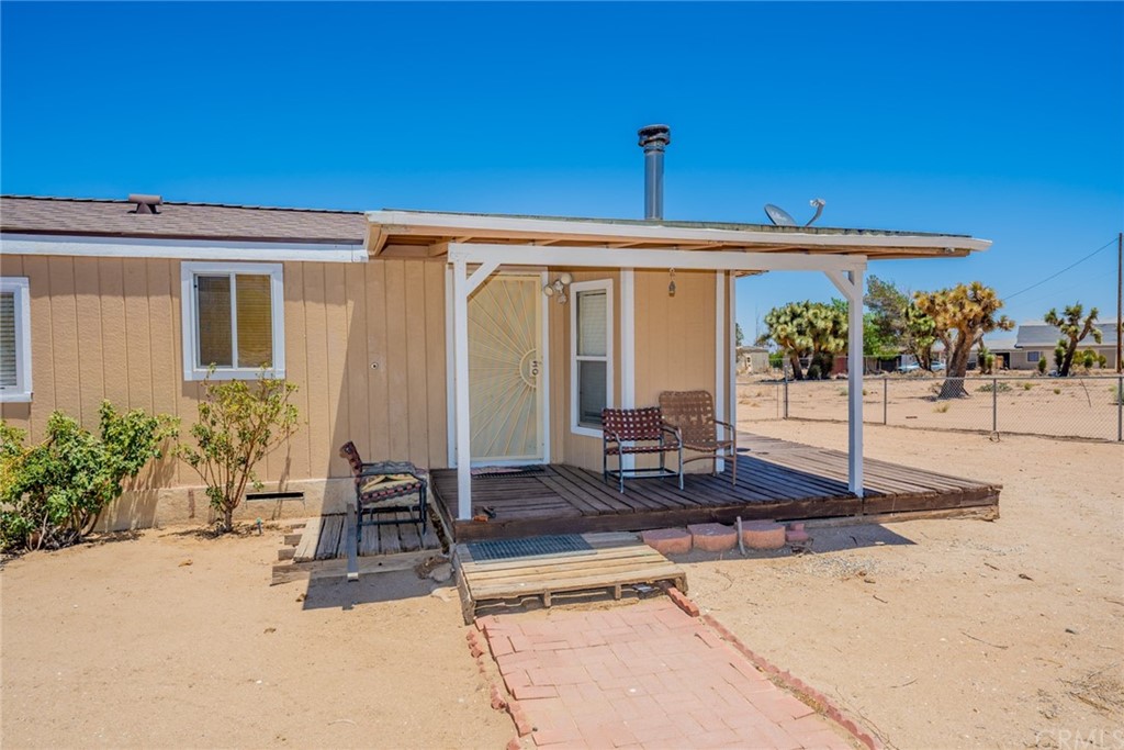 6788 Trinity Road Phelan, CA 92371 - Photo 1 of 1 a front view of a house with a porch