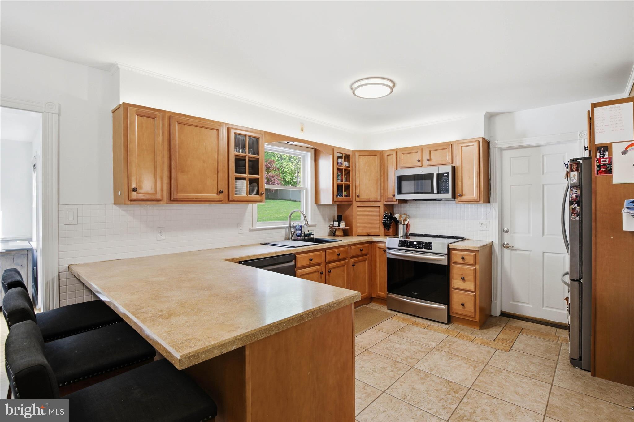 237 Delp Road Lancaster, PA 17601 - Photo 12 of 47 a kitchen with stainless steel appliances granite countertop a sink stove and refrigerator