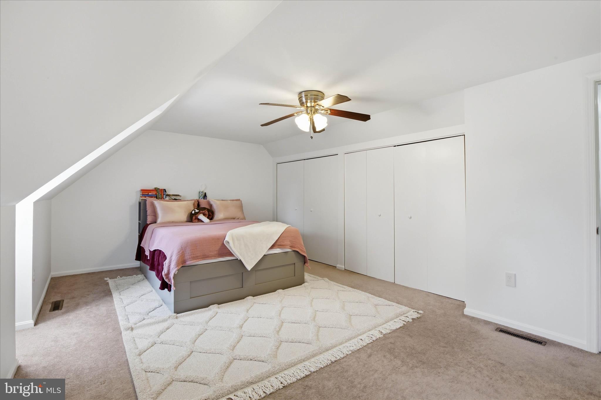 237 Delp Road Lancaster, PA 17601 - Photo 22 of 47 a bedroom with a bed and a chandelier fan