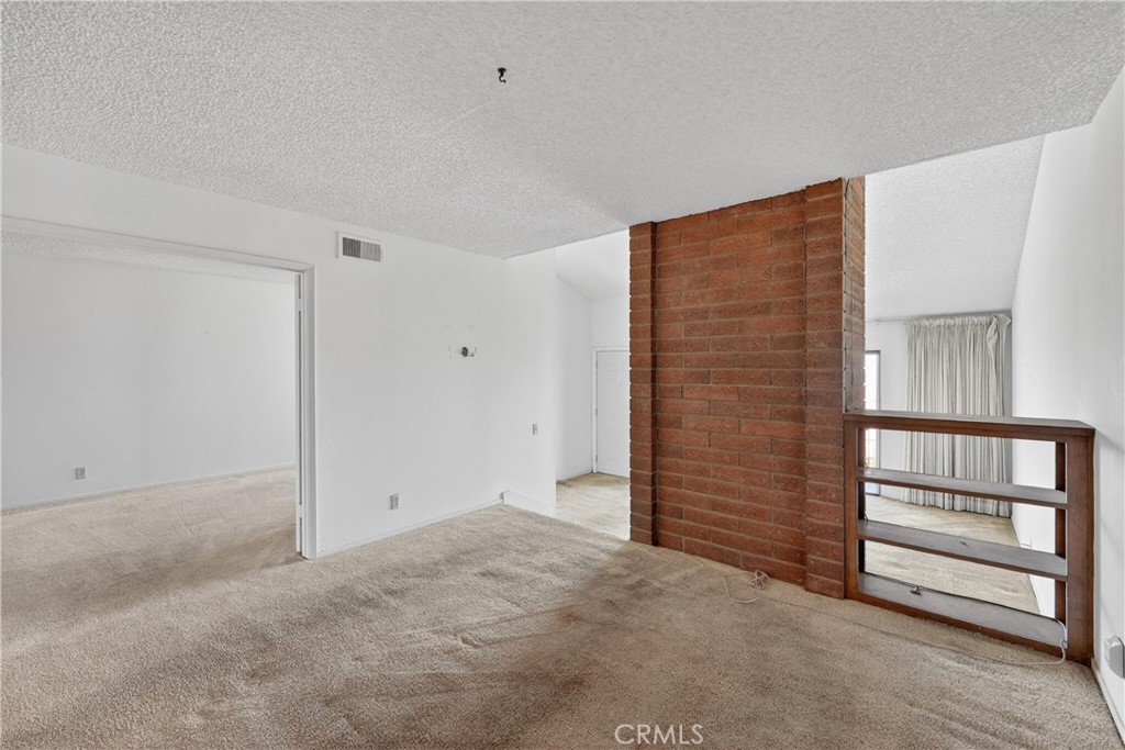28307 Ridgehaven Court, Unit 72 Rancho Palos Verdes, CA 90275 - Photo 13 of 60 a view of an empty room with a cabinet
