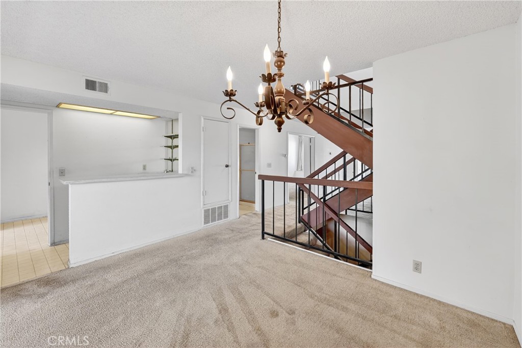 28307 Ridgehaven Court, Unit 72 Rancho Palos Verdes, CA 90275 - Photo 15 of 60 a view of a livingroom with wooden floor and stairs