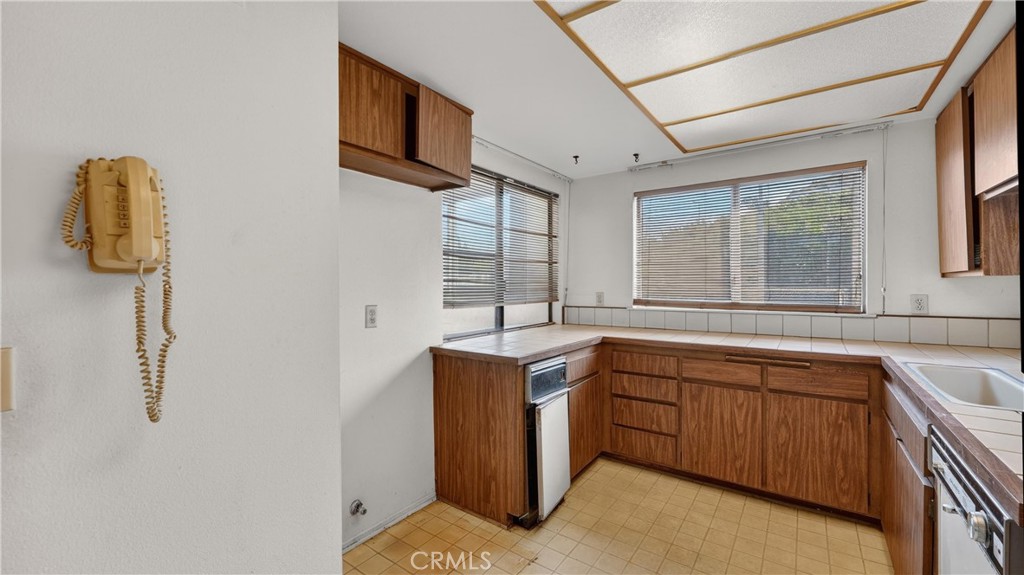 28307 Ridgehaven Court, Unit 72 Rancho Palos Verdes, CA 90275 - Photo 25 of 60 a kitchen with a sink and large window