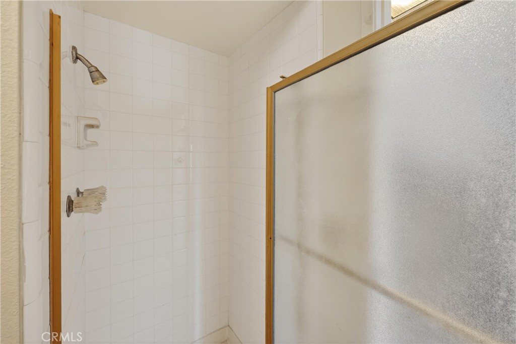 28307 Ridgehaven Court, Unit 72 Rancho Palos Verdes, CA 90275 - Photo 30 of 60 a bathroom with a glass shower door