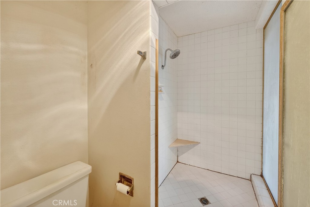 28307 Ridgehaven Court, Unit 72 Rancho Palos Verdes, CA 90275 - Photo 40 of 60 a bathroom with a shower and a toilet