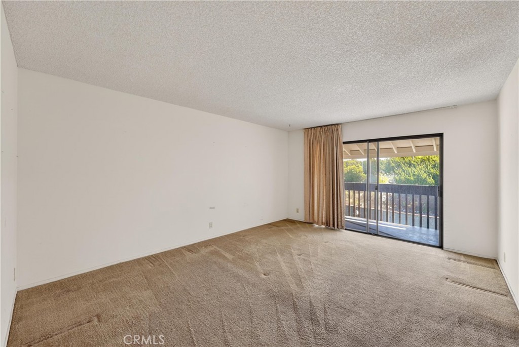 28307 Ridgehaven Court, Unit 72 Rancho Palos Verdes, CA 90275 - Photo 41 of 60 an empty room with wooden floor and windows