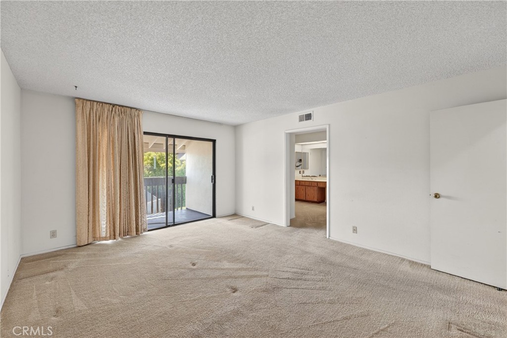 28307 Ridgehaven Court, Unit 72 Rancho Palos Verdes, CA 90275 - Photo 42 of 60 a view of an empty room with window and kitchen