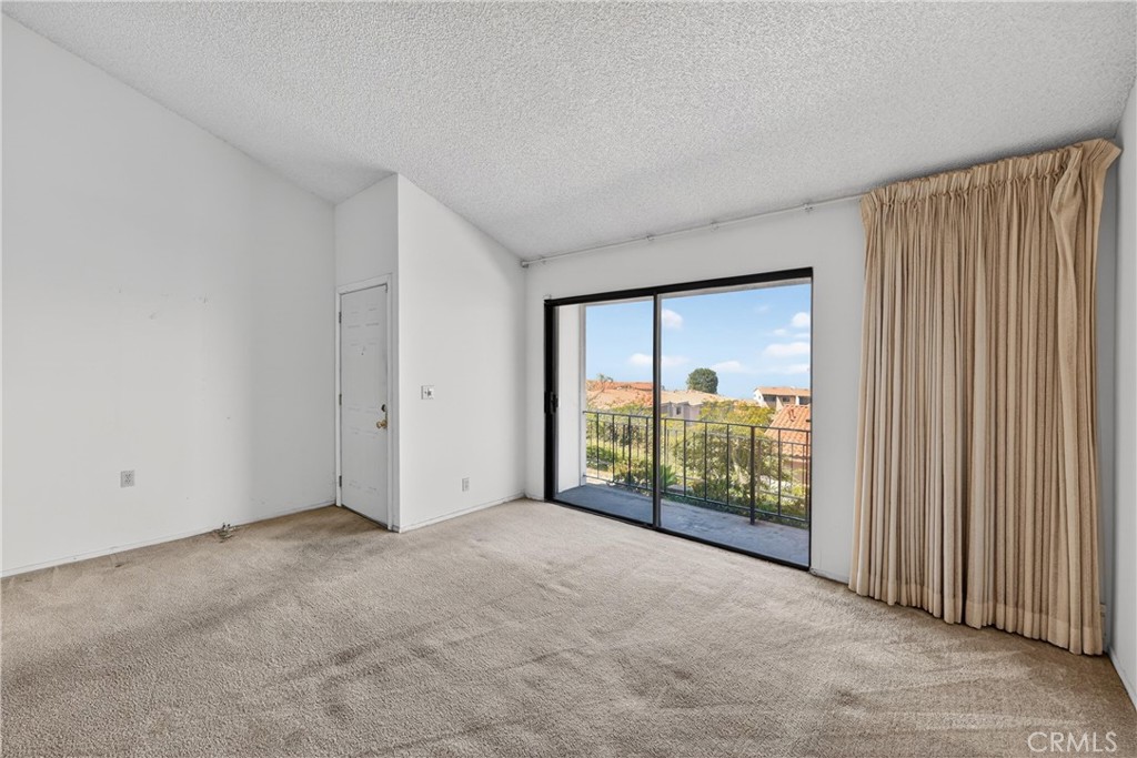 28307 Ridgehaven Court, Unit 72 Rancho Palos Verdes, CA 90275 - Photo 8 of 60 a view of an empty room with a window