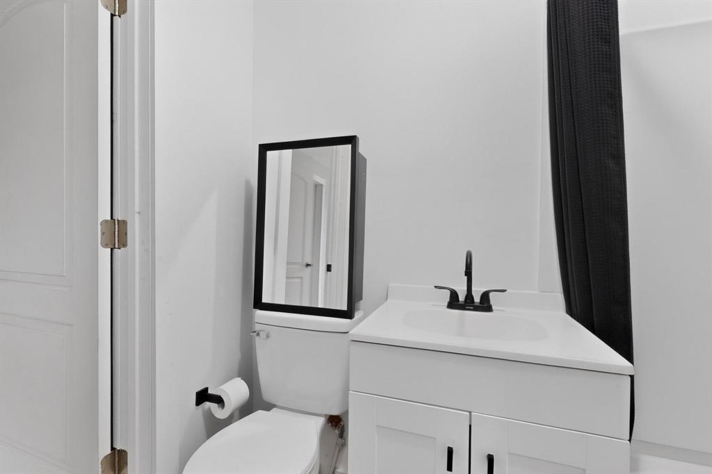 313 Farm To Market 316 Eustace, TX 75124 - Photo 26 of 33 a bathroom with a sink and a mirror