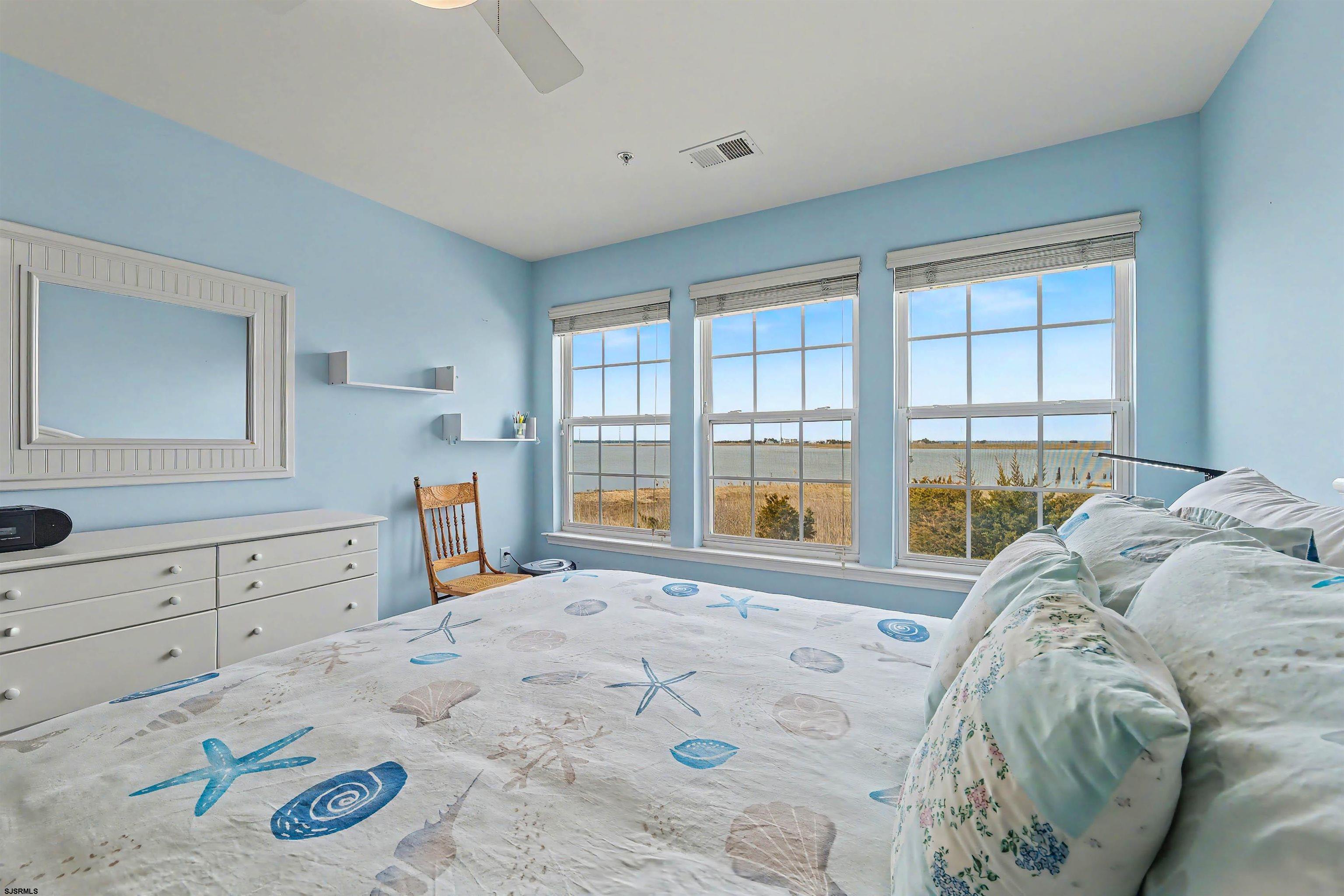 35 Bayside Drive, Unit 35 Somers Point, NJ 08244 - Photo 16 of 40 a bed sitting in a bedroom next to a window