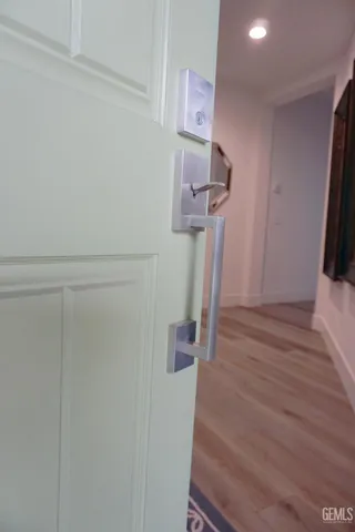 a living room with a potted plant and a table