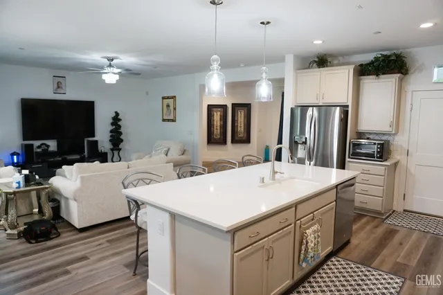 a dining room with furniture and wooden floor