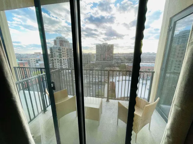 a view of a room with wooden floor and porch