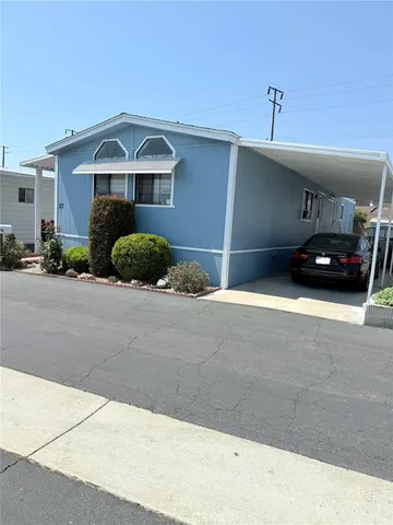 a front view of a house with parking space
