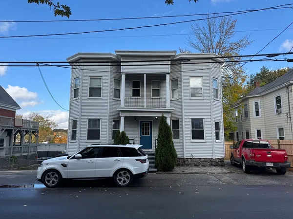a car parked in front of a house