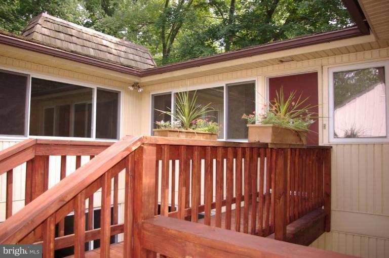 3503 Russell Road Alexandria, VA 22305 - Photo 1 of 16 a view of a house with porch and wooden floor