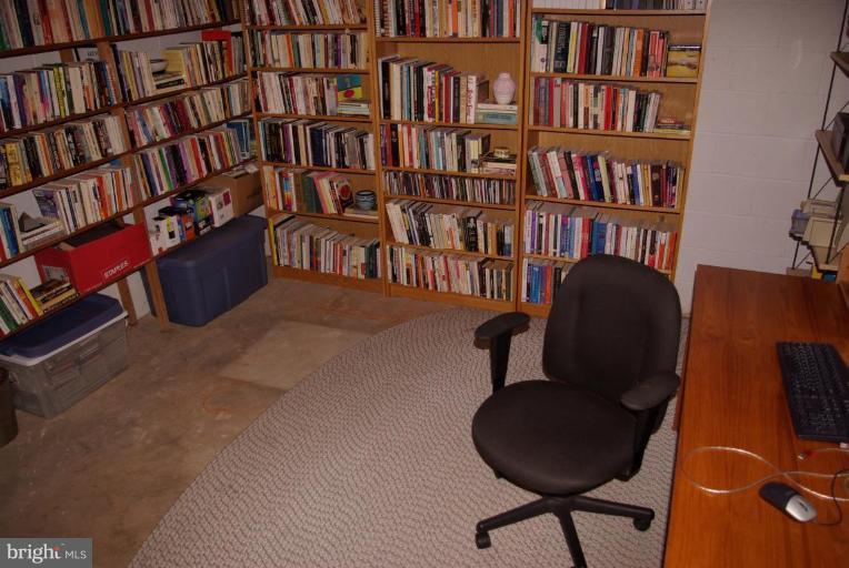 3503 Russell Road Alexandria, VA 22305 - Photo 13 of 16 a work room with furniture and book shelf
