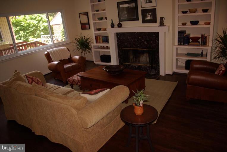 3503 Russell Road Alexandria, VA 22305 - Photo 4 of 16 a living room with furniture a window and a fireplace