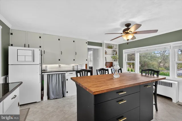 a view of a livingroom with furniture and hardwood floor