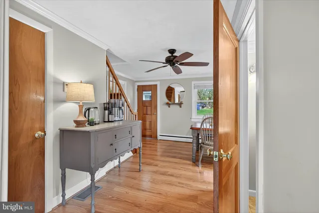 a view of a livingroom with furniture and wooden floor