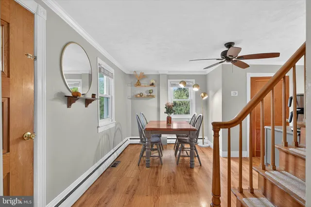 a bedroom with a bed and a window with chair