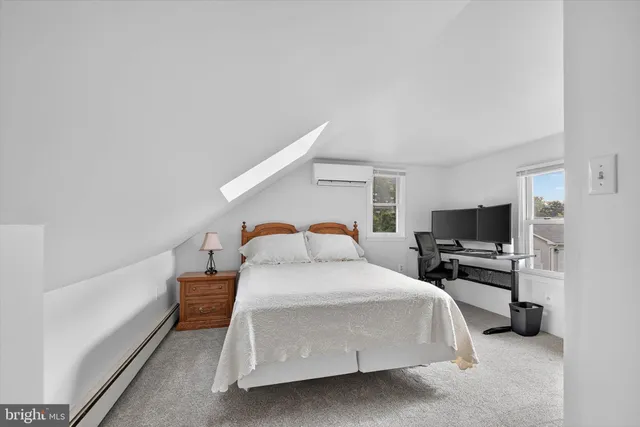 a view of yard with green space and trees in the background