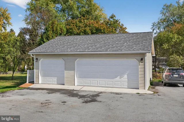 a picture of a bench in front of a gate