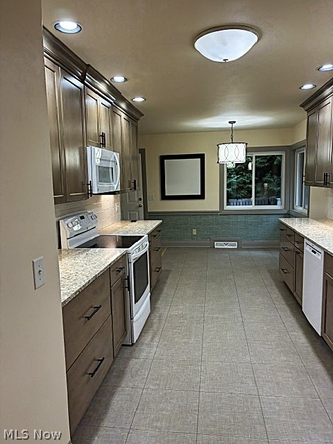 303 Somerset Road Akron, OH 44313 - Photo 6 of 29 Another view of the kitchen leading to the dining area.
