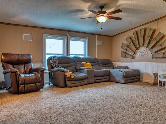 6341 Farm Private Road Levelland, TX 79336 - Photo 12 of 46 a living room with furniture and a ceiling fan