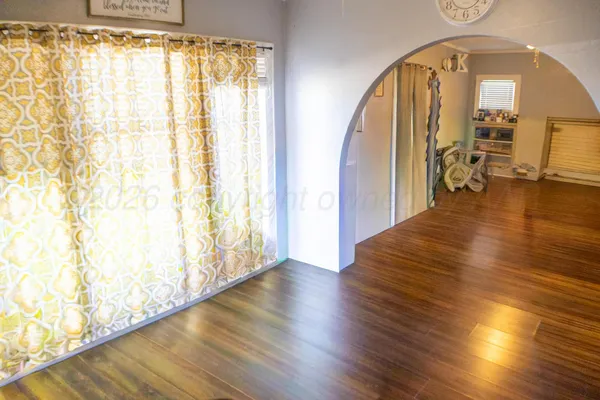 a view of an entryway with wooden floor