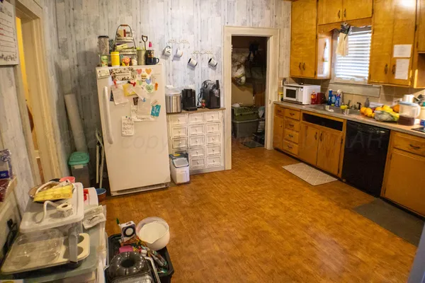 a kitchen with stainless steel appliances granite countertop a sink and cabinets