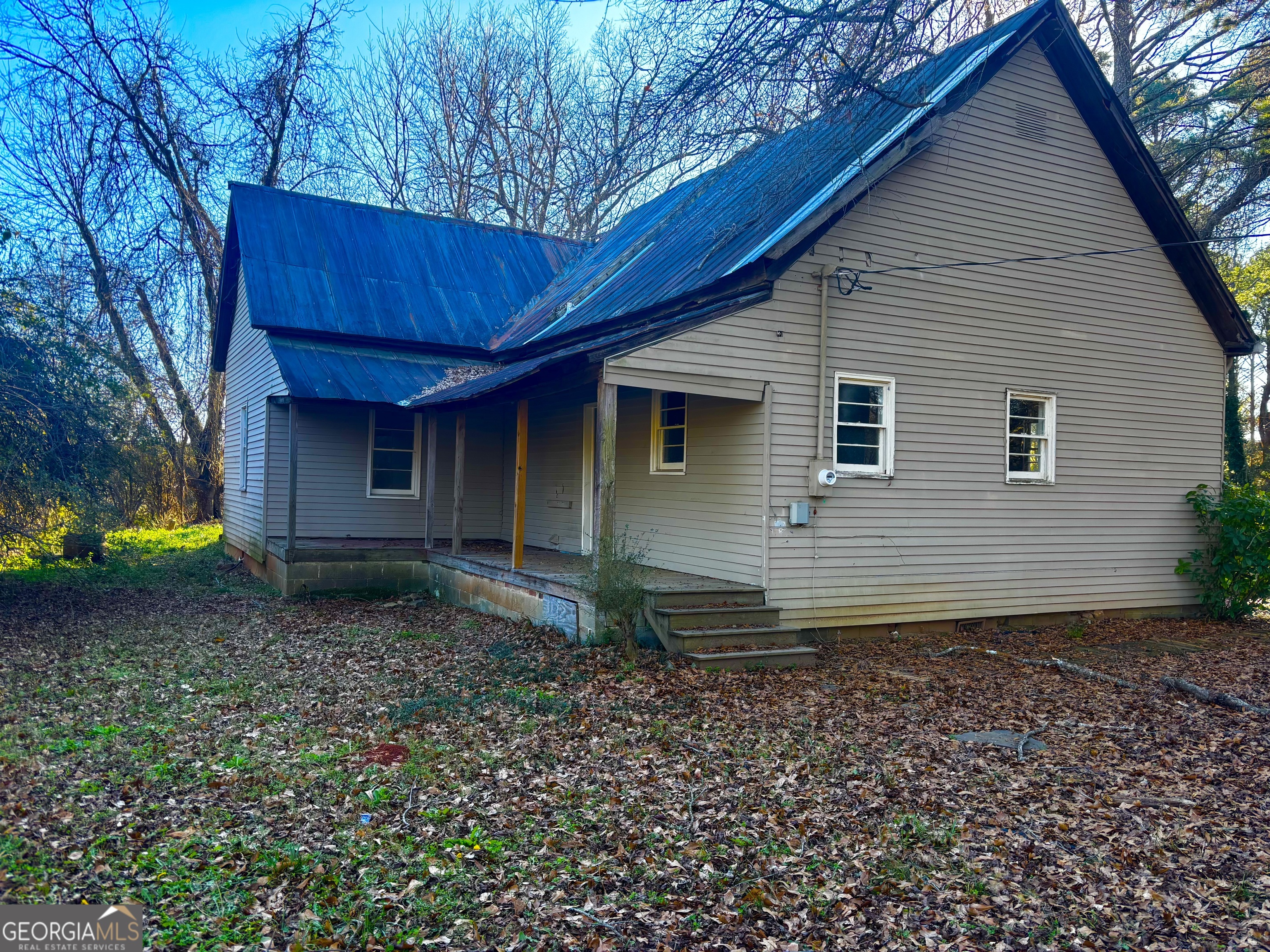585 Huddleston Road Fayetteville, GA 30214 - Photo 11 of 11 a view of a house with a yard and garage