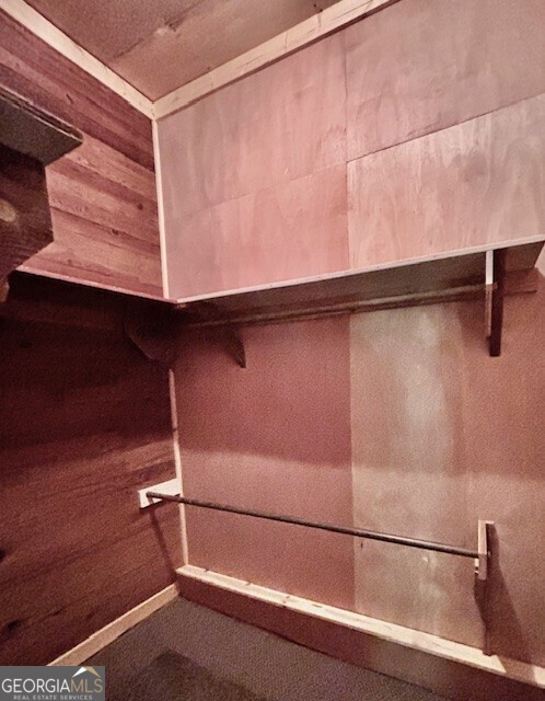 585 Huddleston Road Fayetteville, GA 30214 - Photo 8 of 11 a view of a room with racks on the wall