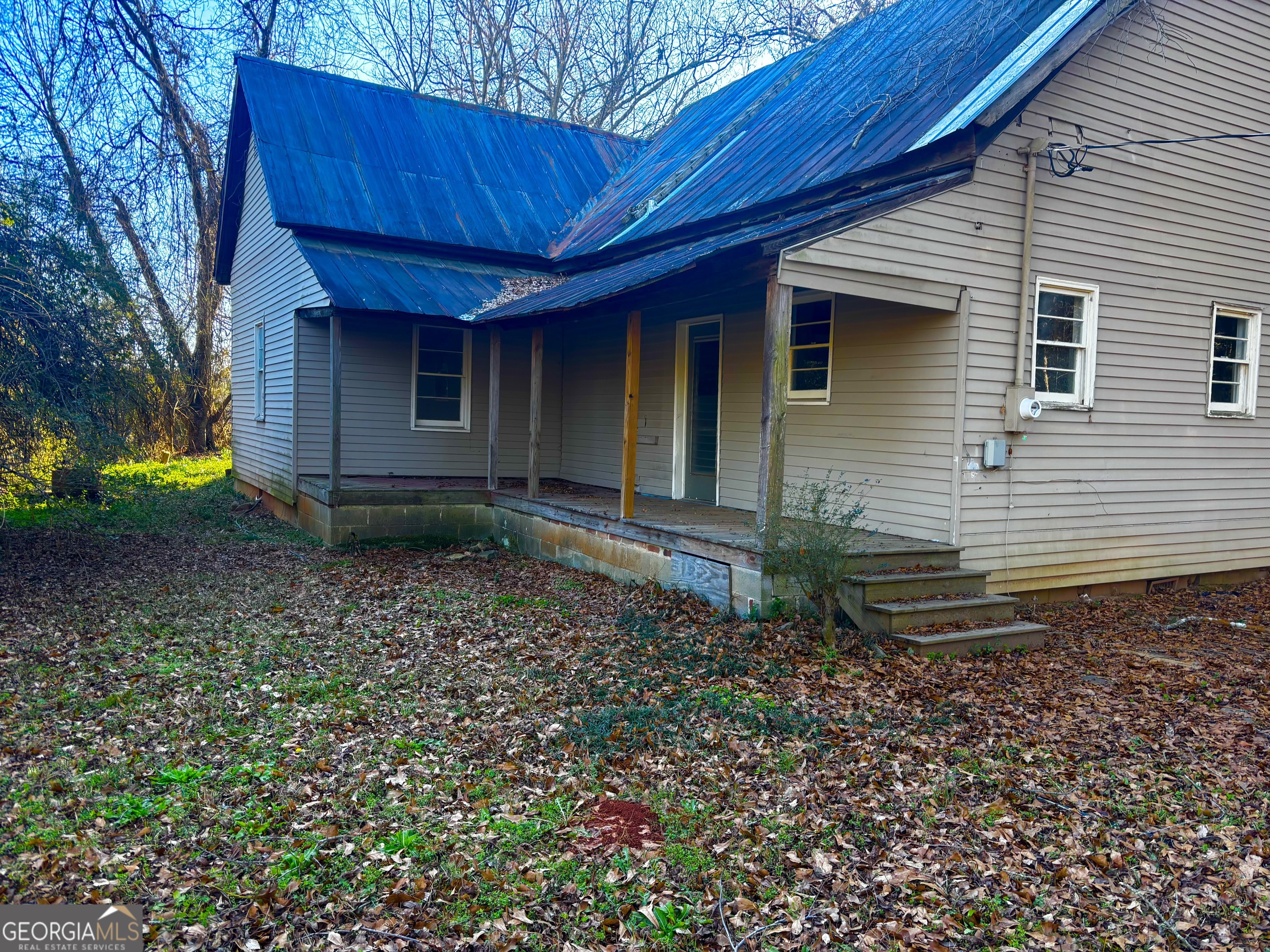 585 Huddleston Road Fayetteville, GA 30214 - Photo 10 of 11 a view of a house with a backyard