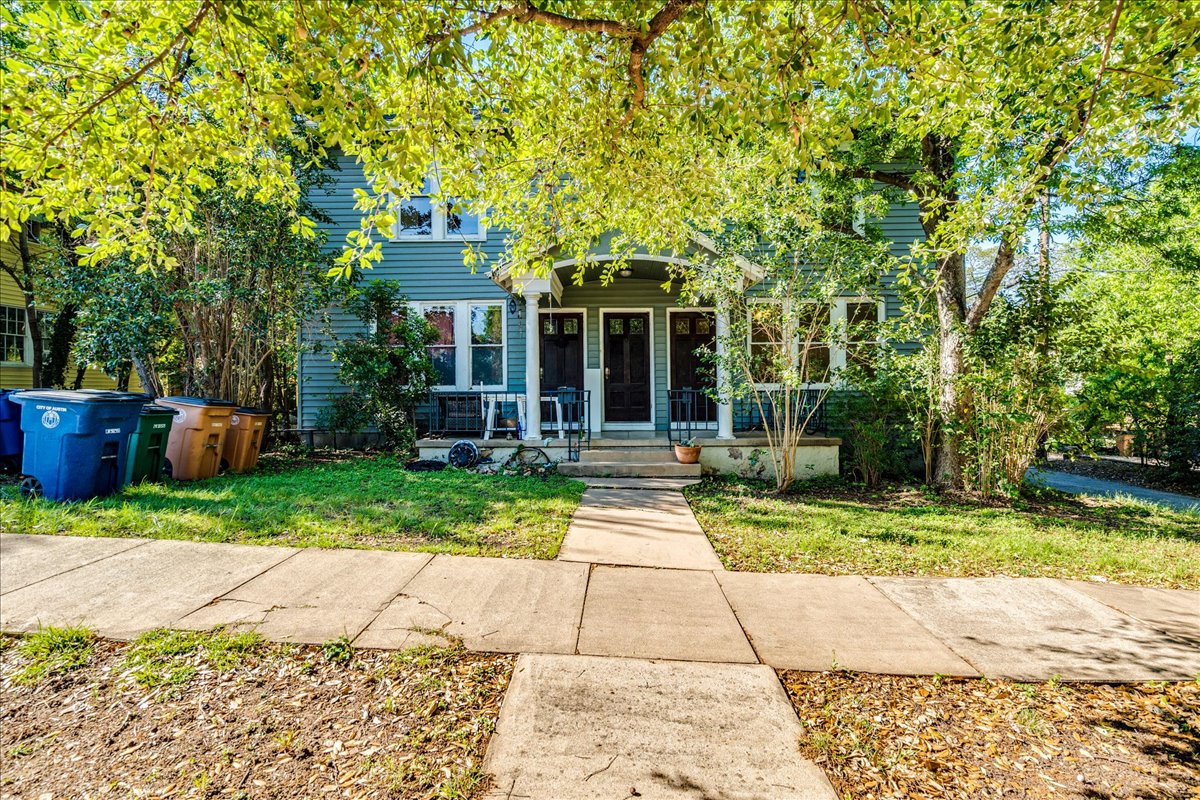 1103 West 22nd Street, Unit B Austin, TX 78705 - Photo 17 of 17 a front view of a house with a yard