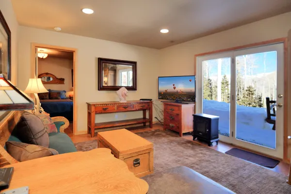 a view of a room with furniture and a fireplace