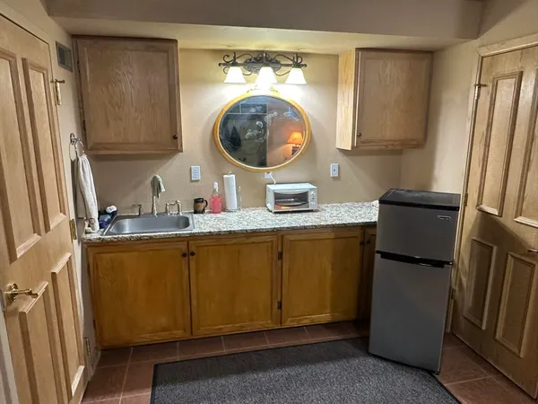 a backyard of a house with barbeque oven