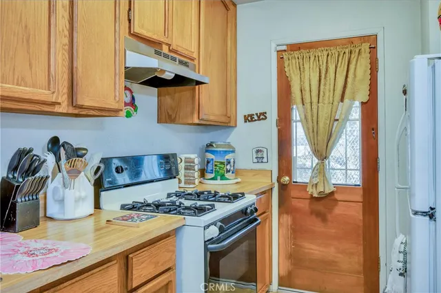 a kitchen with a sink a cabinets and window