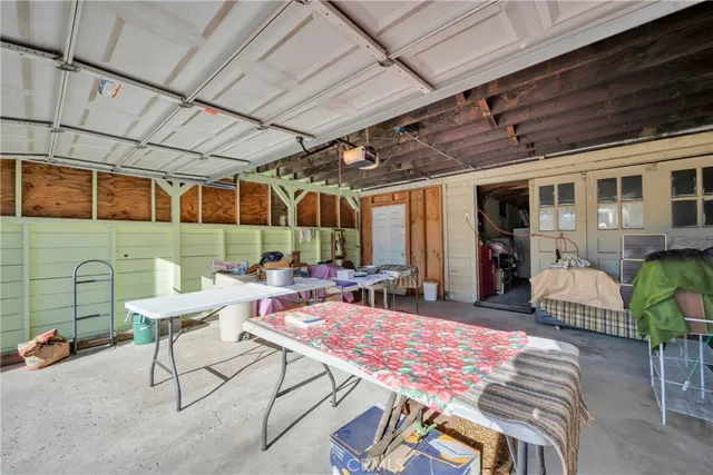 a view of a room with racks air conditioner duct and materials on floor