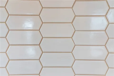 a utility room with water heater and wooden floor