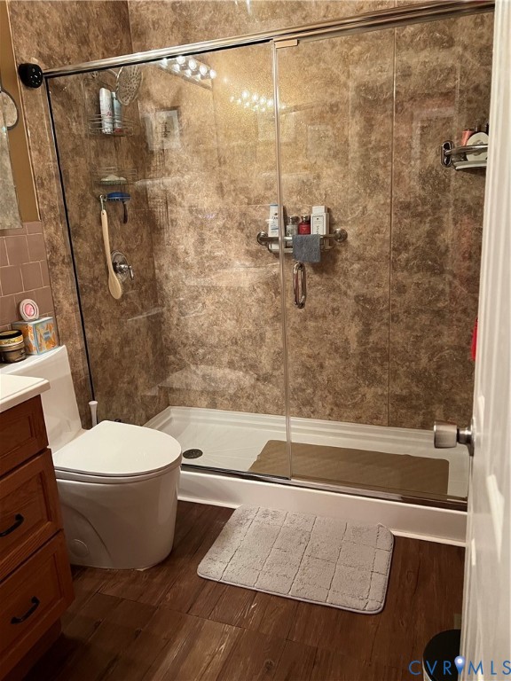 2305 Apollo Road Richmond, VA 23223 - Photo 11 of 16 Bathroom with vanity, a shower stall, and dark woo
